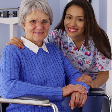 Happy senior woman with friendly Mexican caregiver